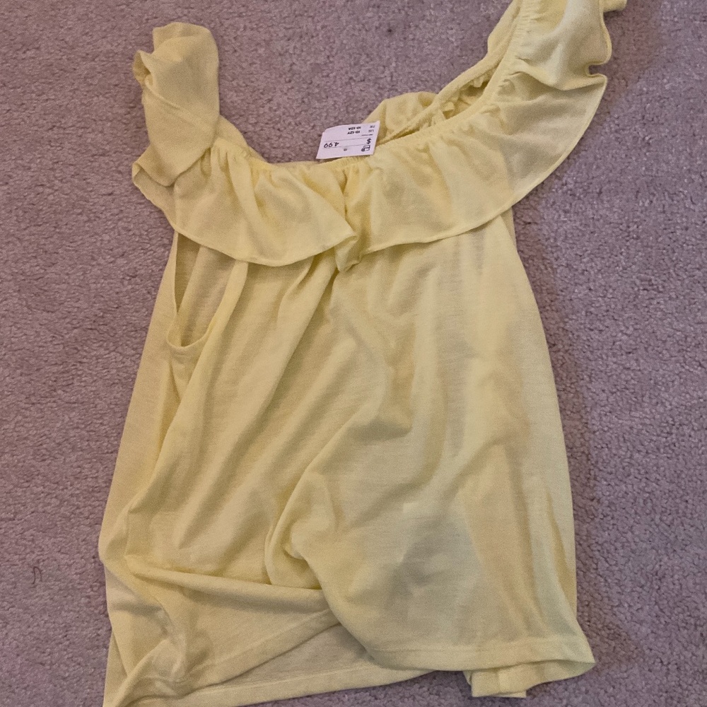 I am selling a girls yellow ruffled shirt!